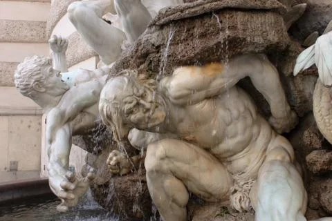 Plastic pose and dramatic expression in this fountain at the entrance of Palace Stock Photos