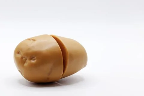 A plastic potato on a white background Stock Photos