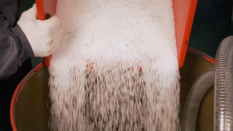 Plastic poured into machine at environmentally friendly waste recycling plant Stock Footage 115935282