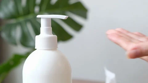 Plastic pump dispenser bottle for liquids and natural body essential oils. Close Stock Footage 197462954