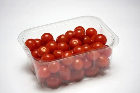 Plastic punnet with cherry tomatoes 写真素材