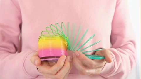 Plastic rainbow toy in hands. Stock Footage 152628481
