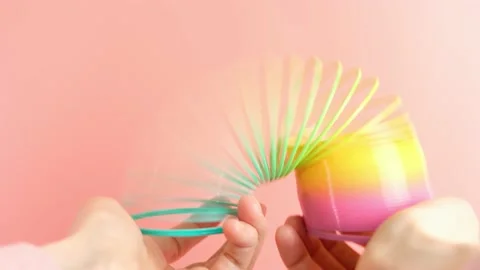 Plastic rainbow toy in hands. Stock Footage 152628615