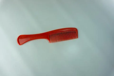 Plastic red comb isolated on white Stock Photos