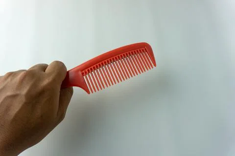 Plastic red comb isolated on white Stock Photos