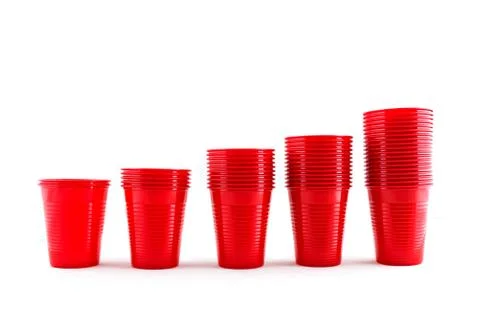 Plastic red cups stack on white background Stock Photos