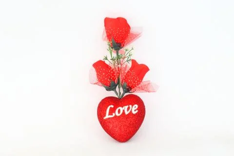 Plastic red roses on a white background. Stock Photos