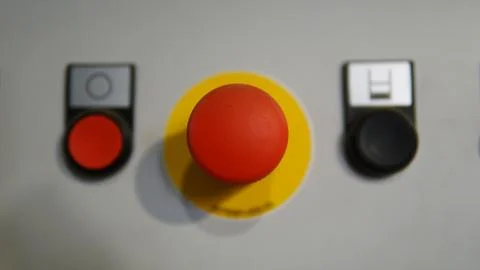 Plastic red stop button for industrial process with others buttons 写真素材