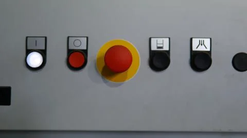 Plastic red stop button for industrial process with others buttons Foto stock