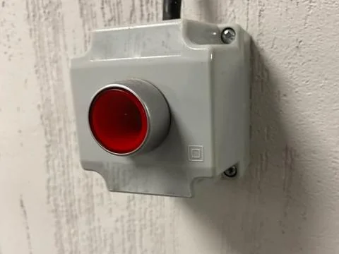 Plastic red stop button for industrial process with others buttons Stock Photos