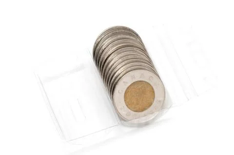 Plastic roll holding two dollar coins Stock Photos