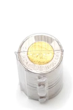 Plastic roll holding two dollar coins 스톡 사진