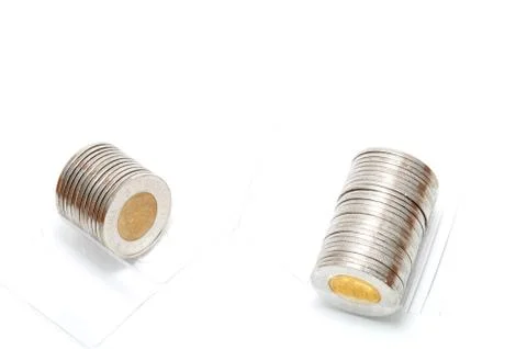 Plastic roll holding two dollar coins Stock Photos