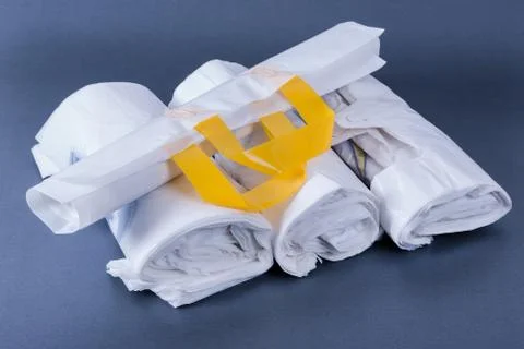 Plastic rolled up bag Stock Photos