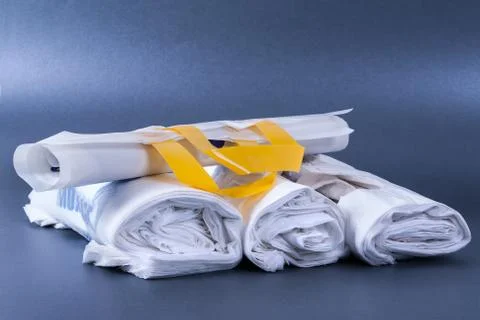 Plastic rolled up bag Stock Photos