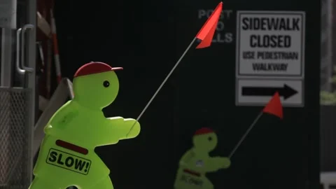 Plastic Safety Mannequin and Sidewalk Closed Sign Stock Footage 341322845