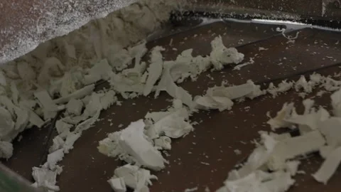 Plastic Scrap Flakes Moving On Conveyor At Recycling Grinder Exit Stock Footage 337913264