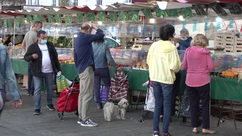 Plastic sheets, face masks at market, Covid-19 second wave Paris France Stock Footage 139685397