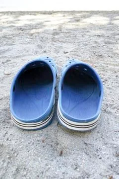 Plastic shoes on the beach Stock-Fotos