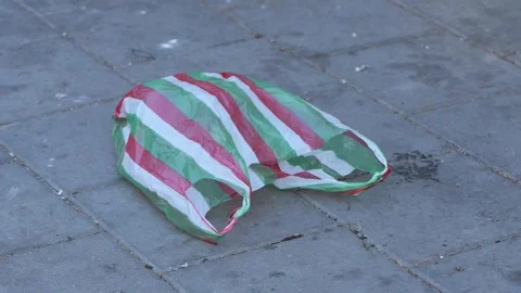 Plastic shopping bag pollution on pavement 스톡 동영상 341954355