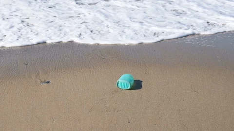 Plastic soap container flow in sea waves shore,dirty ecosystem, industrial trash Stock Footage 124302781