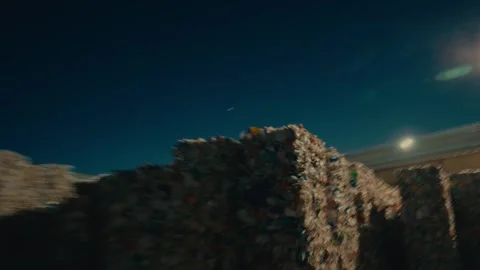 Plastic Sorting Facility Exterior at Night Showing Stacked Recycled Bales Stock Footage 331166631