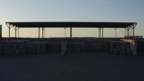 Plastic Sorting Facility Featuring Large Compressed Bales Under Shelter 库存影片 331166677