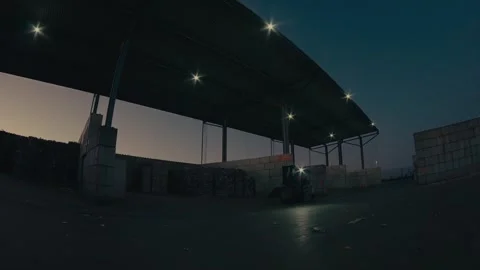 Plastic Sorting Facility with a Forklift Moving Materials at Dusk 库存影片 331166575