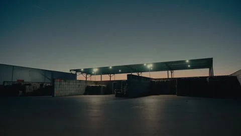 Plastic Sorting Facility Storage Area at Dusk with Industrial Lights on Stock-Footage 331166615