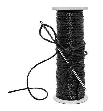 Plastic spool with black synthetic threads close-up. Needle and thread Stock Photos