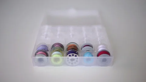Plastic spools of high quality cotton pastel colors sewing thread Stock Footage 112243849