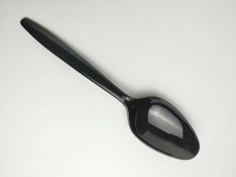 Plastic spoon isolated on white background. Stock Photos