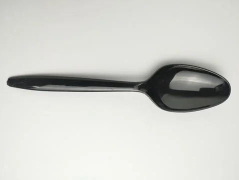 Plastic spoon isolated on white background. Stock Photos