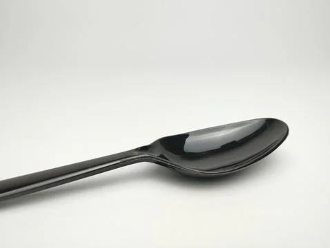 Plastic spoon isolated on white background. Stock Photos