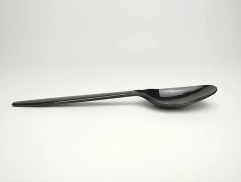 Plastic spoon isolated on white background. Stock Photos