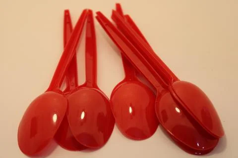 Plastic spoons for use in kitchen plastic utensils are very common in kitchen Stock Photos