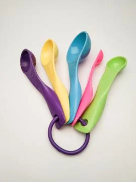 Plastic spoons of various sizes and colors Stock Photos