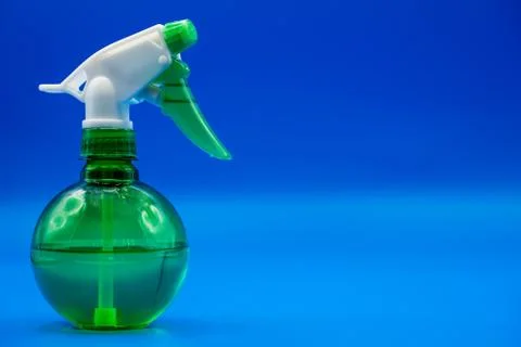 Plastic spray bottle with copy space. Liquid sprayer isolated Stock Photos