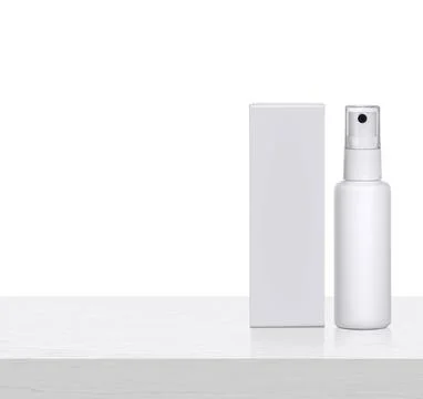 Plastic spray bottles blank and packaging on white wooden table. for packagin Stock Photos