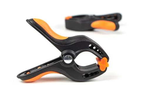 Plastic spring clamp isolated on white background. Clamping equipment. Workin 스톡 사진