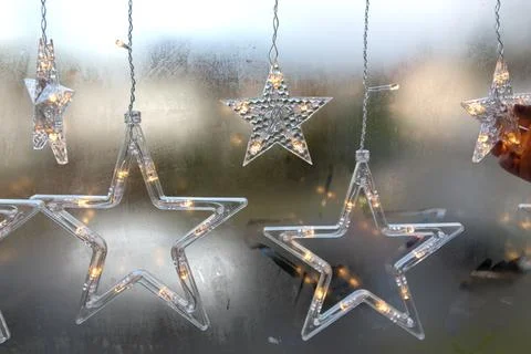 Plastic stars on the window. Stock Photos