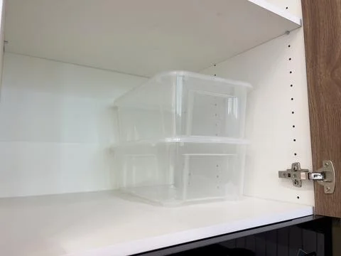 Plastic storage box in the kitchen, close-up of photo Stock Photos