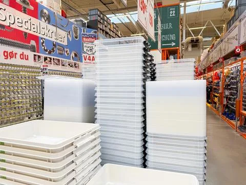 Plastic storage containers displayed in hardware store. Stock Photos