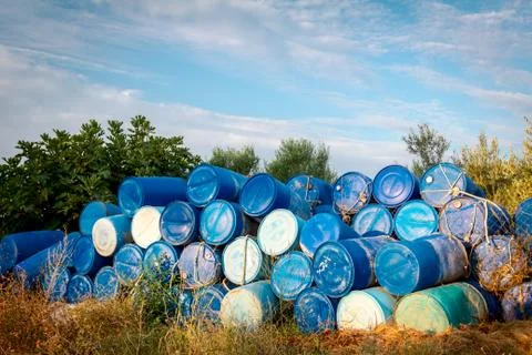 Plastic storage of drums, big blue barrels stacked up Stock Photos