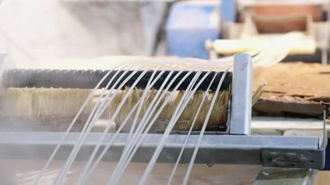 Plastic strands go to strand cutter to recycle plastic and create pellets Stock Footage 150511647