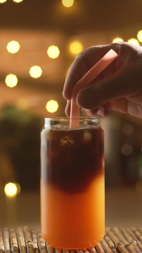 Plastic Straw Stirring Bumble Coffee In Glass Stock Footage 337725625
