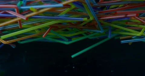 Plastic Straws Floating In The Ocean. Plastic Pollution, Polluting The World. Stock Footage 111933743