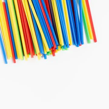 Plastic straws on white background, environment concept Stock Photos