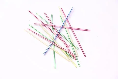 Plastic straws on a white background. Stock Photos