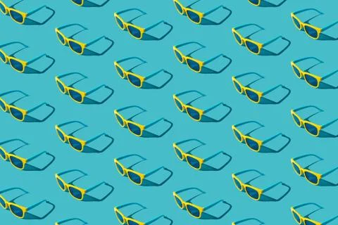 Plastic sunglasses pattern on turquoise blue background with hard shadow Stock Photos